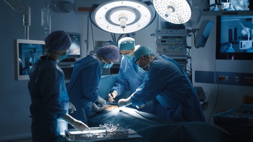 surgeons using fiber optics